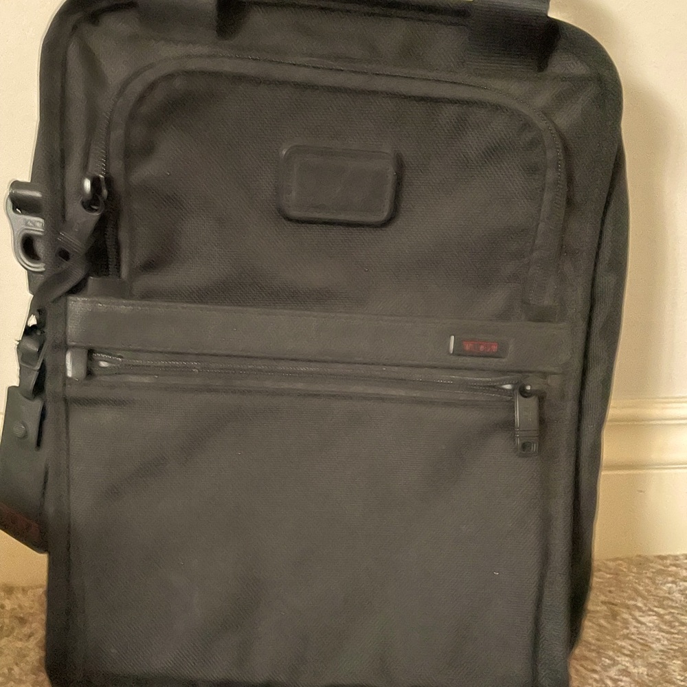 NWT Tumi black expandable nylon bag. Timeless